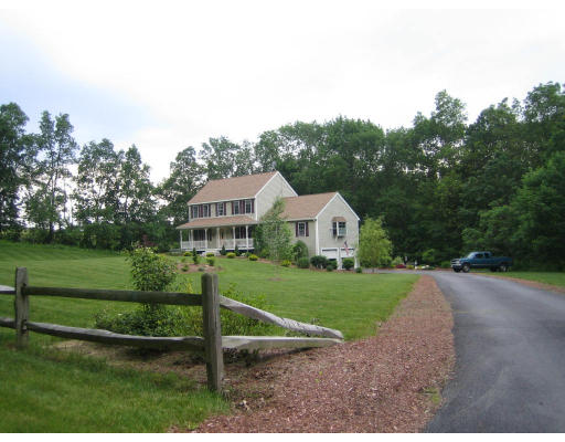 22 A Vinton Road Charlton, MA 01507 - Photo 1 of 24 a front view of a house with a yard