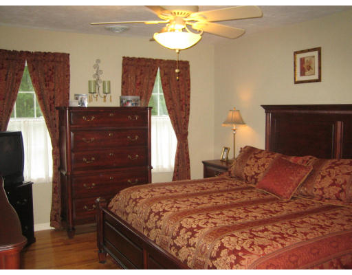 22 A Vinton Road Charlton, MA 01507 - Photo 15 of 24 a bedroom with a bed and a mirror on the dresser