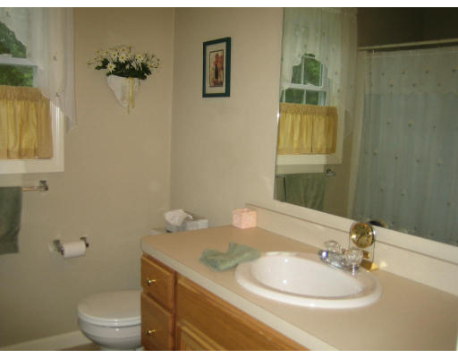 22 A Vinton Road Charlton, MA 01507 - Photo 16 of 24 a bathroom with a granite countertop sink toilet and a mirror