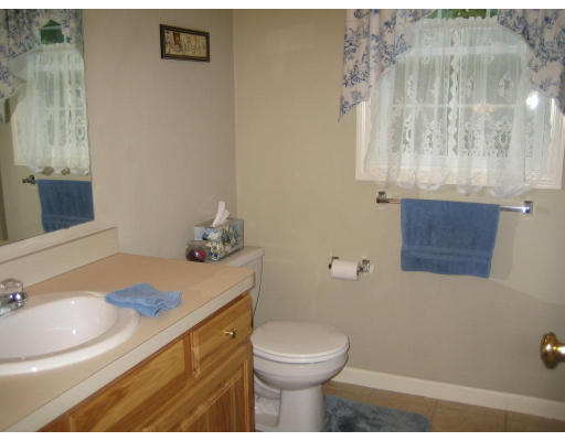 22 A Vinton Road Charlton, MA 01507 - Photo 20 of 24 a bathroom with a sink a toilet and mirror