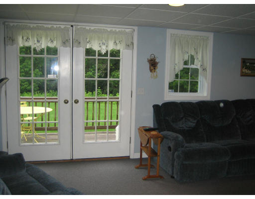 22 A Vinton Road Charlton, MA 01507 - Photo 21 of 24 a living room with furniture and a window