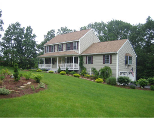 22 A Vinton Road Charlton, MA 01507 - Photo 3 of 24 a front view of a house with a yard table and chairs
