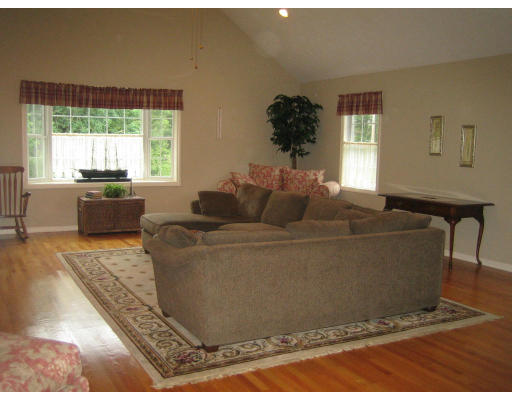 22 A Vinton Road Charlton, MA 01507 - Photo 6 of 24 a living room with a couch and a window