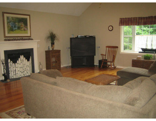 22 A Vinton Road Charlton, MA 01507 - Photo 7 of 24 a bedroom with a bed and a fireplace