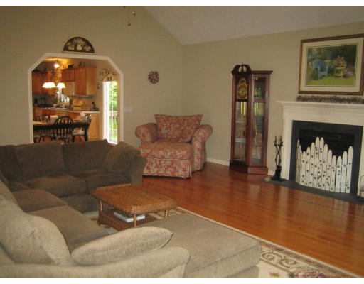 22 A Vinton Road Charlton, MA 01507 - Photo 8 of 24 a living room with furniture and a fireplace