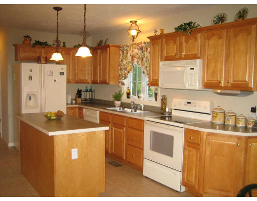 22 A Vinton Road Charlton, MA 01507 - Photo 10 of 24 a kitchen with stainless steel appliances granite countertop a sink a stove and a refrigerator
