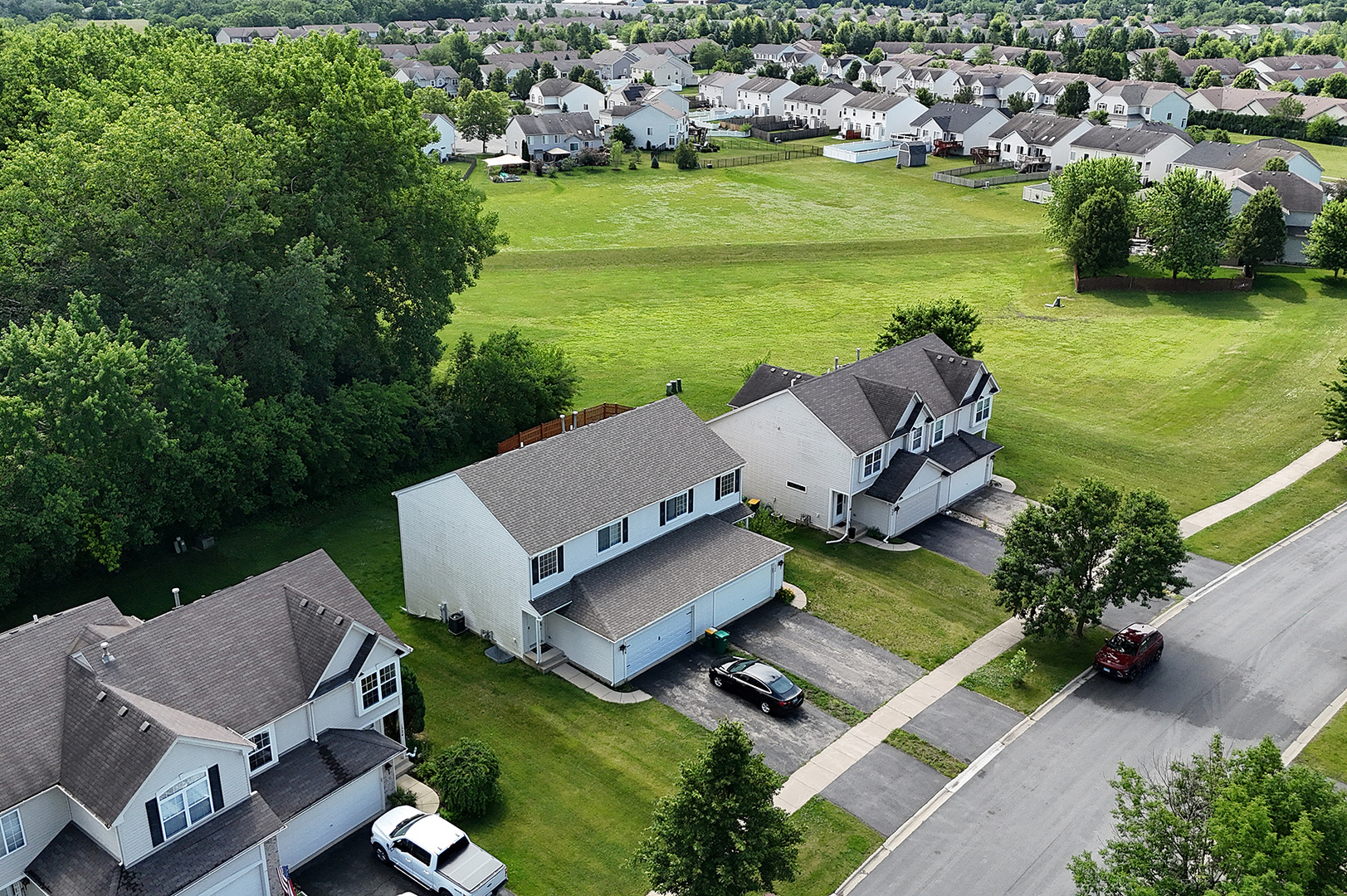 1526 Peachtree Lane Lockport, IL 60441 - Photo 1 of 28 an aerial view of a house with a garden and swimming pool