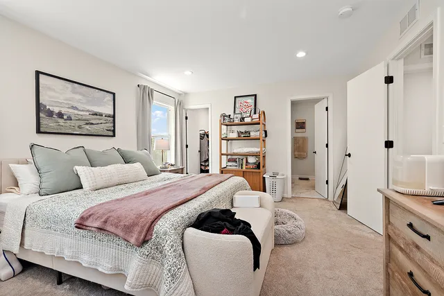 a bed room with a bed and a book shelf