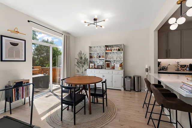 a view of a dining room with furniture window and outside view