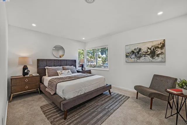 a bedroom with bed and a window