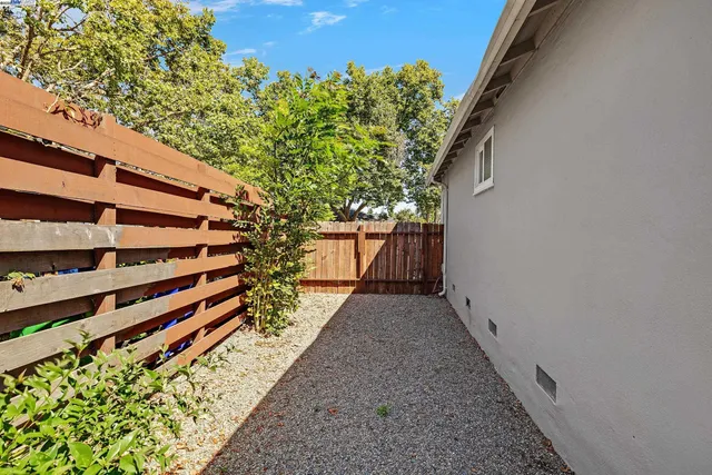 a backyard of a house with lots of green space