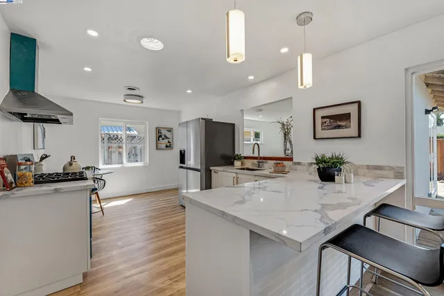 a view of kitchen and dining area with furniture