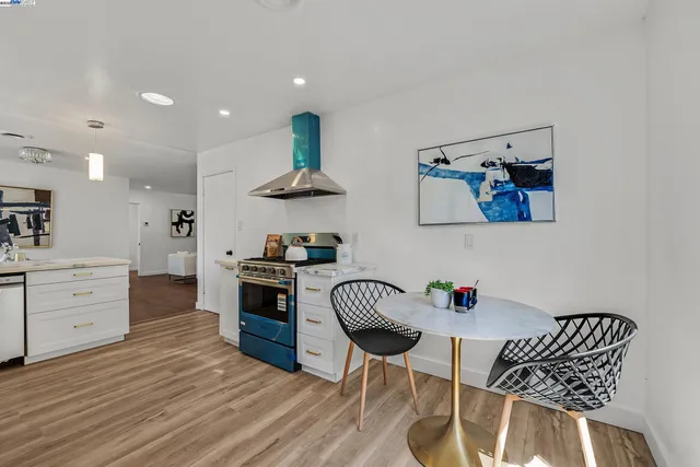 a kitchen with stainless steel appliances kitchen island granite countertop a sink and cabinets