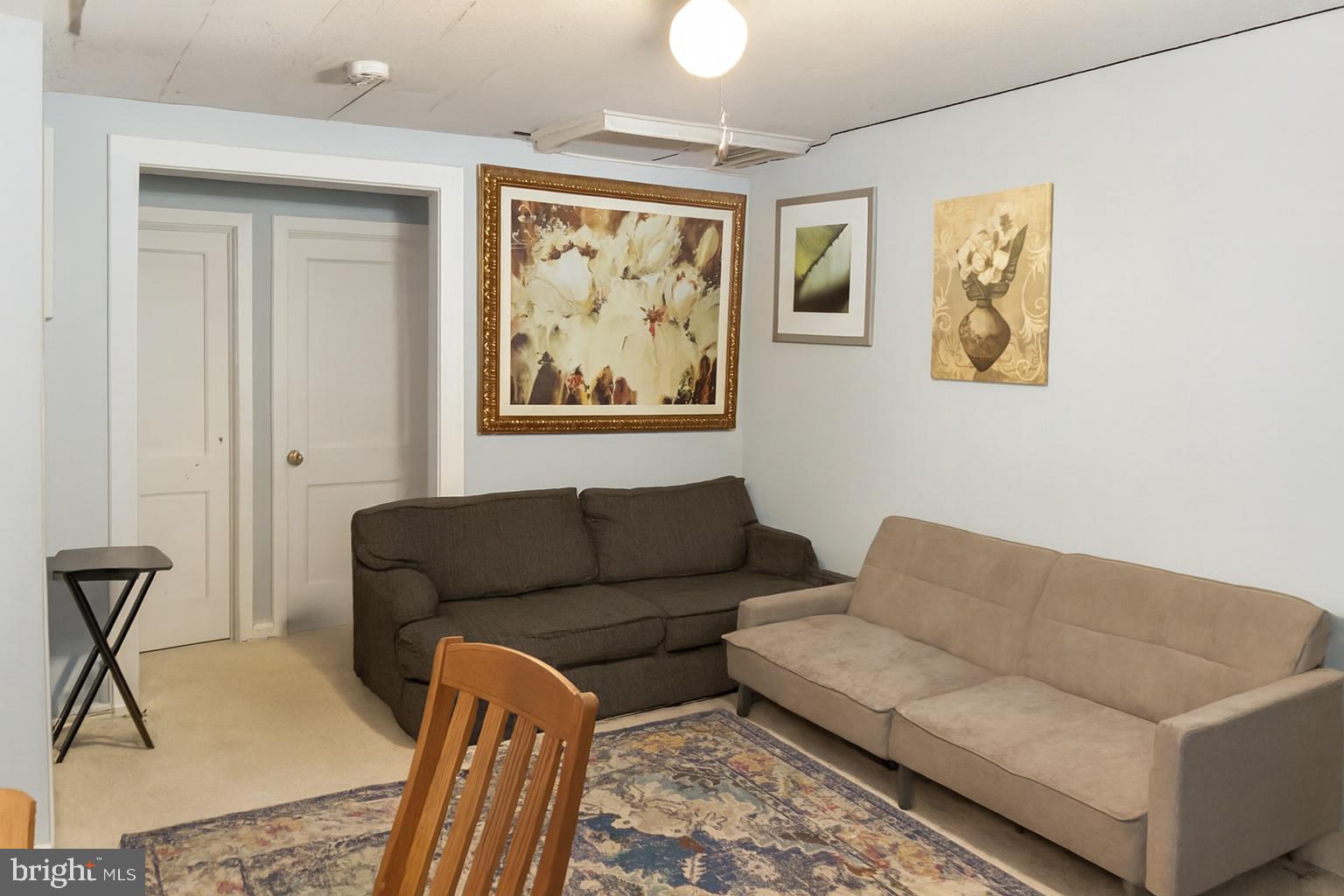 Downstairs unit living room.  Photos enhanced.