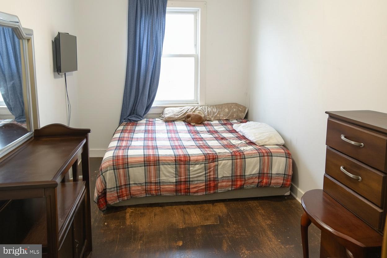 3928 8th Street Baltimore, MD 21225 - Photo 4 of 5 Downstairs unit bedroom 1 of 2. Photos enhanced.