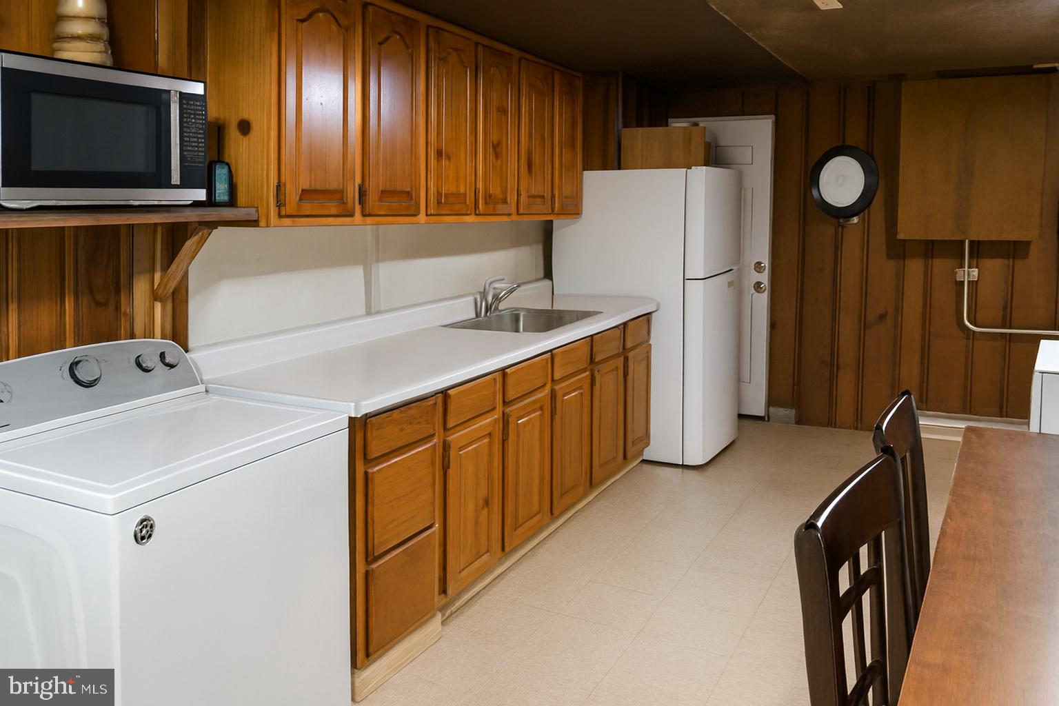 3928 8th Street Baltimore, MD 21225 - Photo 5 of 5 Downstairs unit kitchen. Photos enhanced.