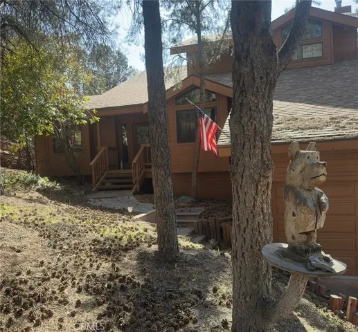 a tree in the backyard of a house