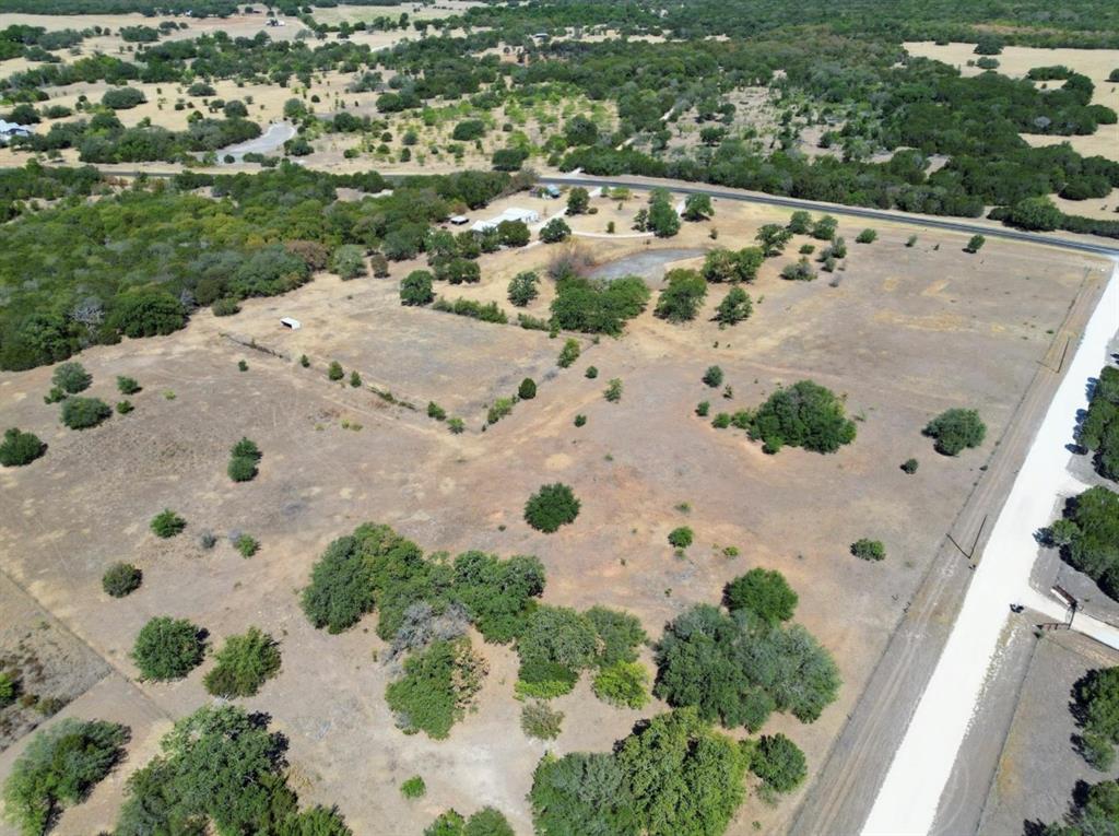 1675 Farm To Market 1713 Morgan, TX 76671 - Photo 3 of 8 an aerial view of a house with a yard