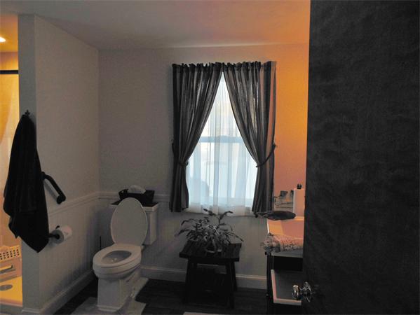 446 Amostown Road West Springfield, MA 01089 - Photo 16 of 22 a bathroom with a toilet sink and mirror