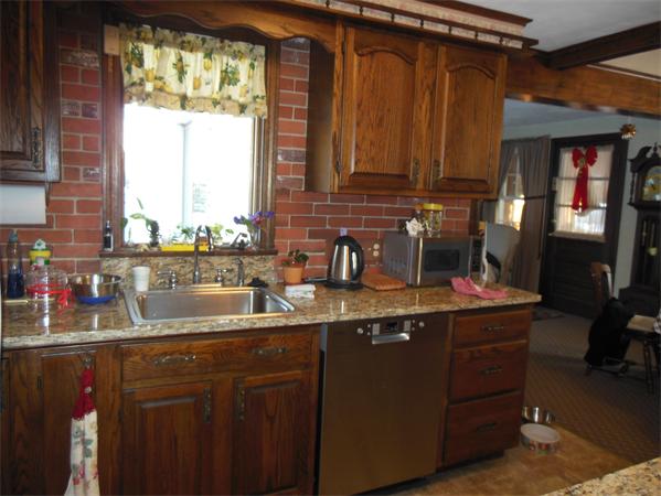 446 Amostown Road West Springfield, MA 01089 - Photo 5 of 22 a kitchen with sink cabinets and a window