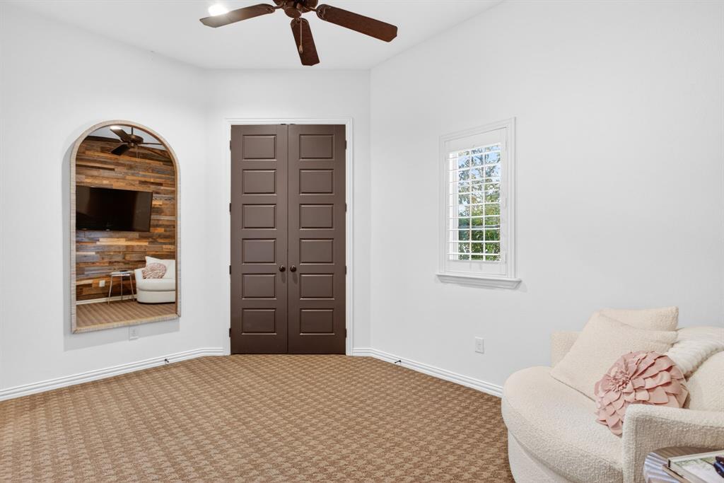 301 Rustic View Lane Aledo, TX 76008 - Photo 28 of 40 a bedroom with a bed and a chandelier
