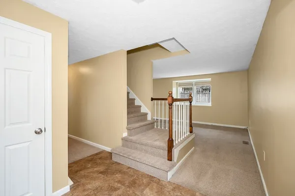 a view of entryway and hall with a dining table