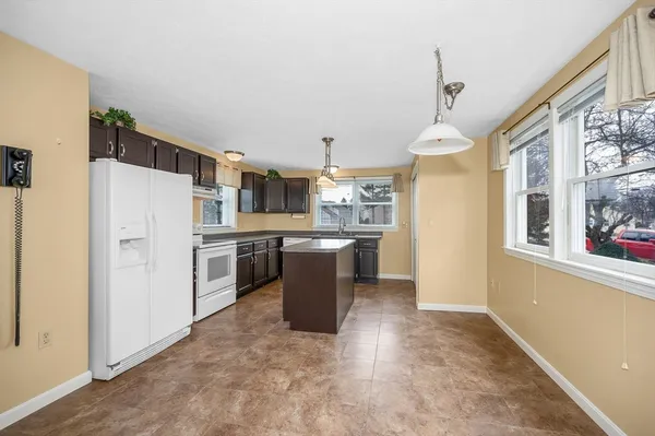 a kitchen with a refrigerator a sink and a stove