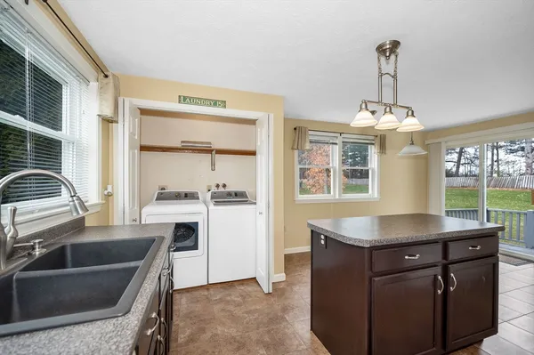 a kitchen with a sink stove and refrigerator