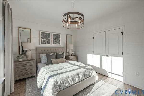 a bedroom with a large bed and a window