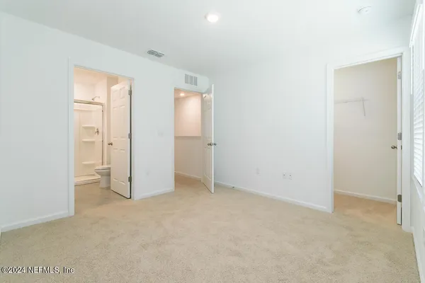 an empty room with closet area