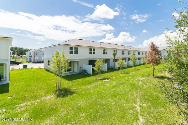 a view of a house with a back yard