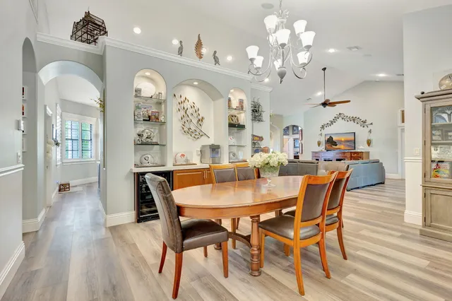 a kitchen with stainless steel appliances granite countertop a sink a stove and a refrigerator