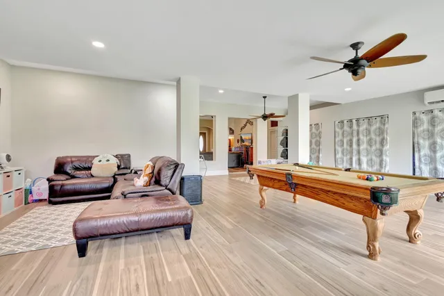 a living room with couch cabinet and a rug