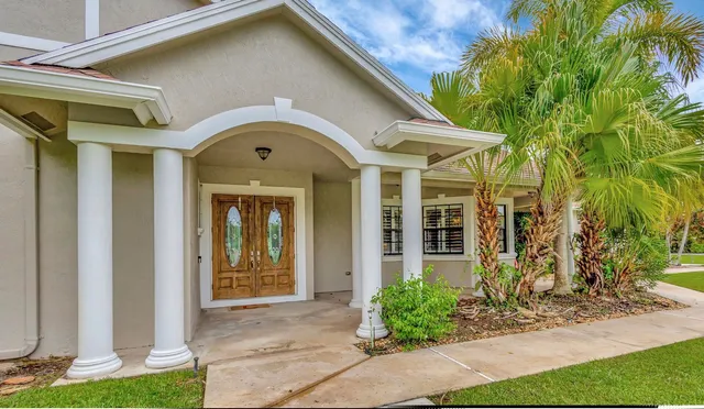 a view of front door with wooden floor