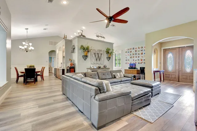 a view of a dining room with furniture and wooden floor