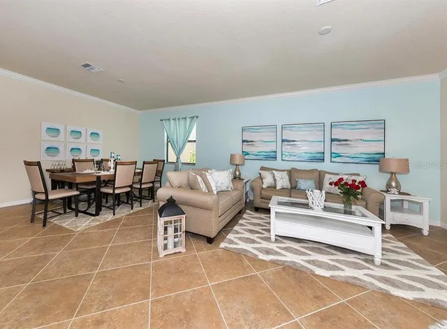 a living room with furniture and a table