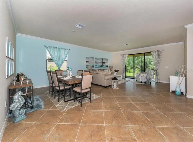 a outdoor space with lots of tables a garden view and a couch
