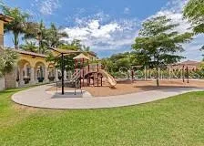 a view of outdoor space with playground and green space