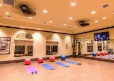 a gym area with lots of table and chairs