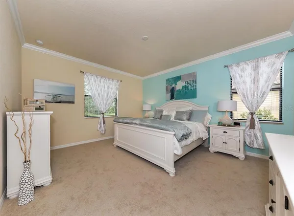 a bed room with a bed and a couch