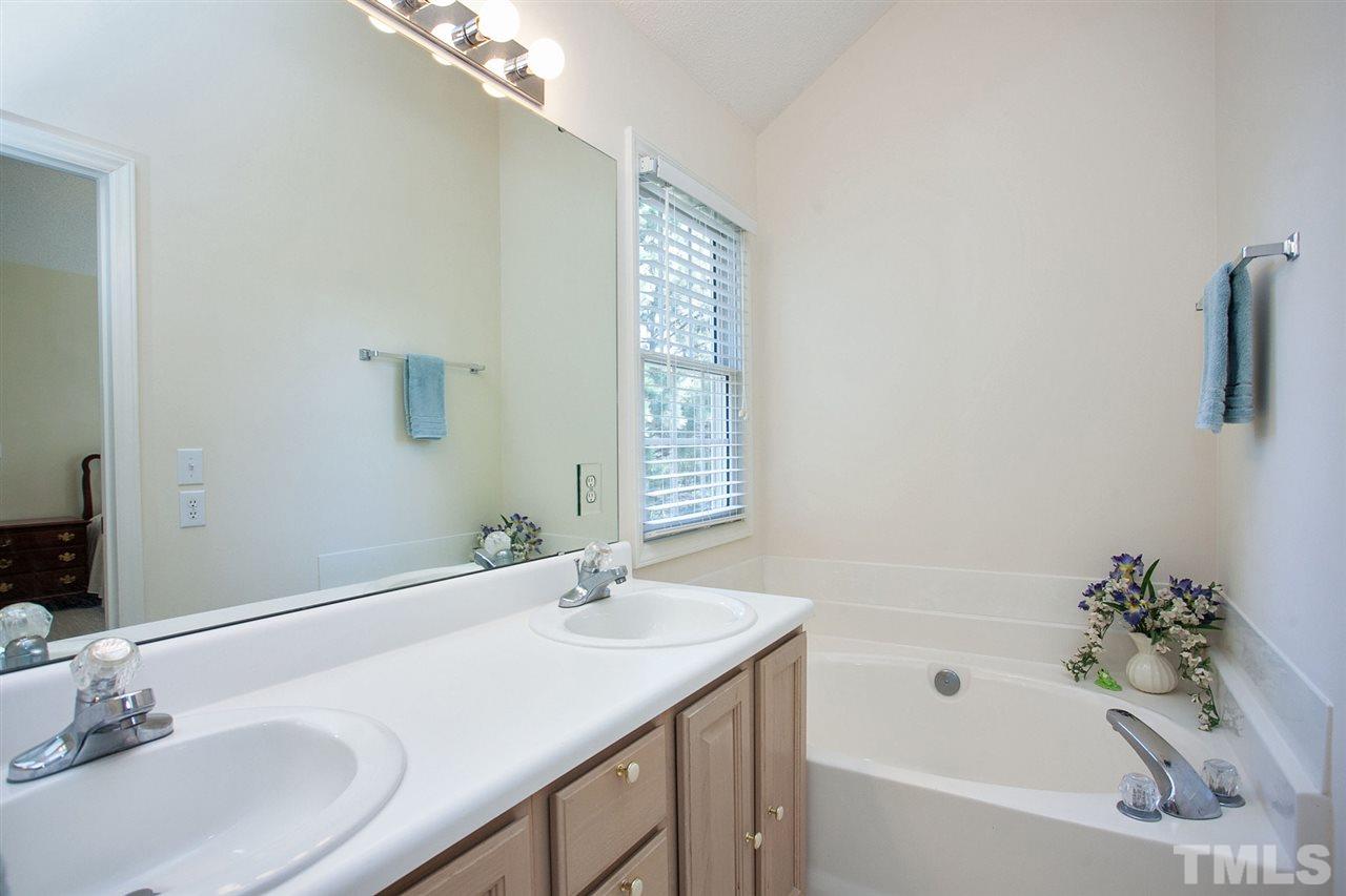 600 Hanska Way Raleigh, NC 27610 - Photo 12 of 18 a bathroom with a sink and a bathtub