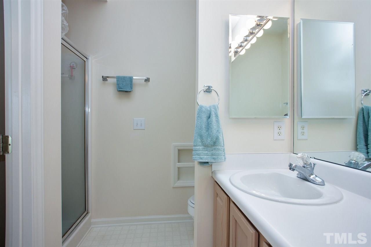 600 Hanska Way Raleigh, NC 27610 - Photo 13 of 18 a bathroom with a sink and a mirror