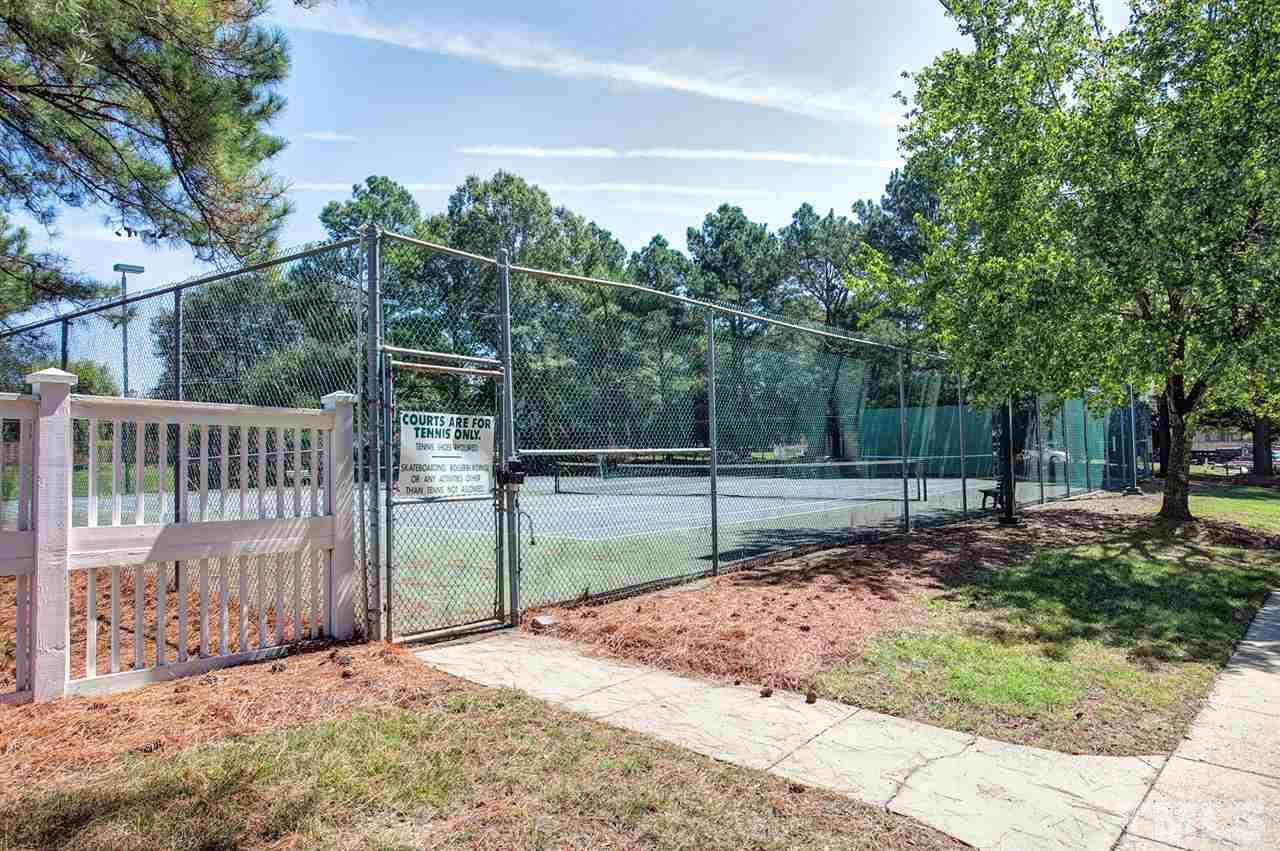 600 Hanska Way Raleigh, NC 27610 - Photo 15 of 18 a view of a backyard with wooden fence