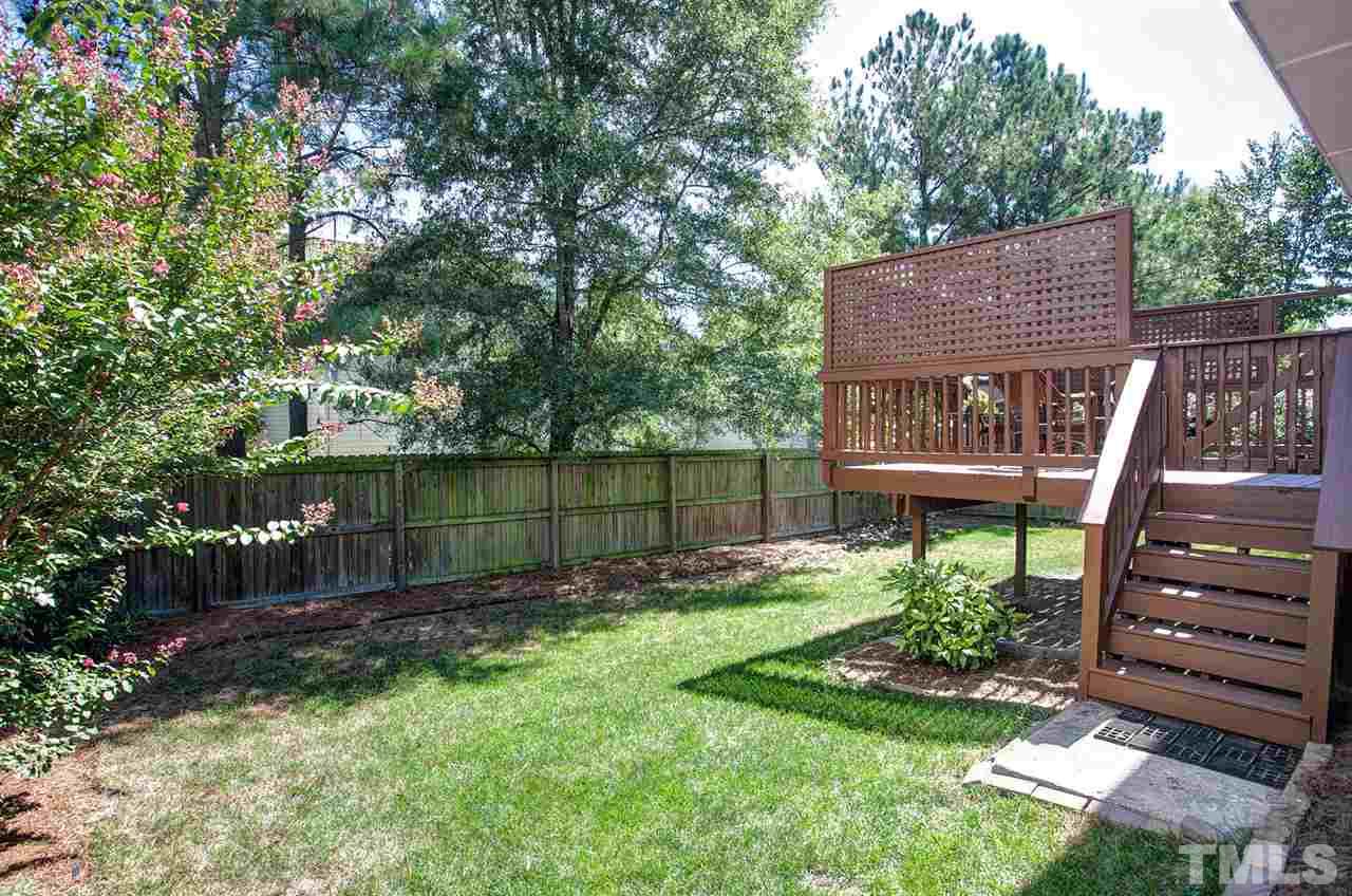 600 Hanska Way Raleigh, NC 27610 - Photo 16 of 18 a view of a chair and table in the backyard
