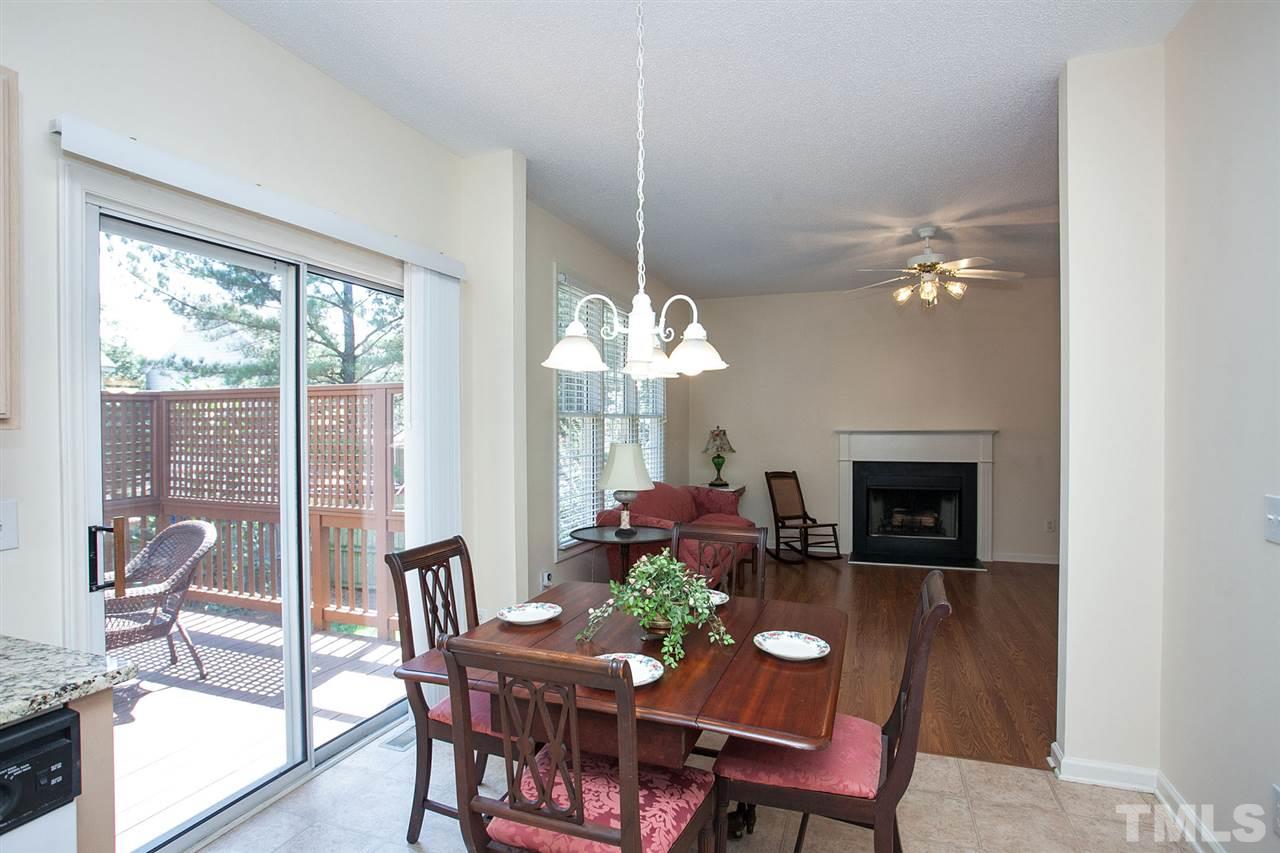 600 Hanska Way Raleigh, NC 27610 - Photo 6 of 18 a dining room with furniture a chandelier and a rug
