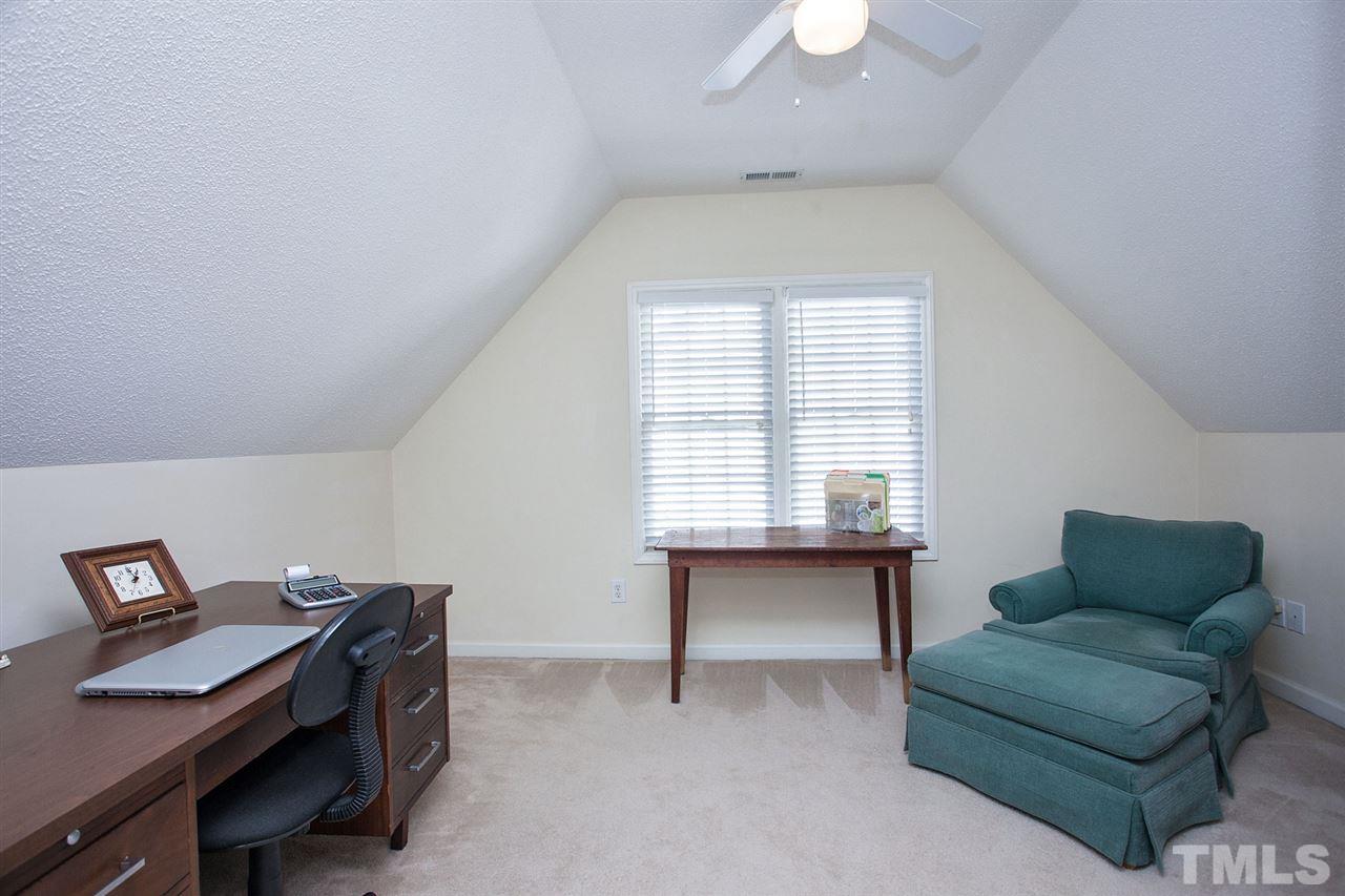 600 Hanska Way Raleigh, NC 27610 - Photo 9 of 18 a workspace with furniture and a window