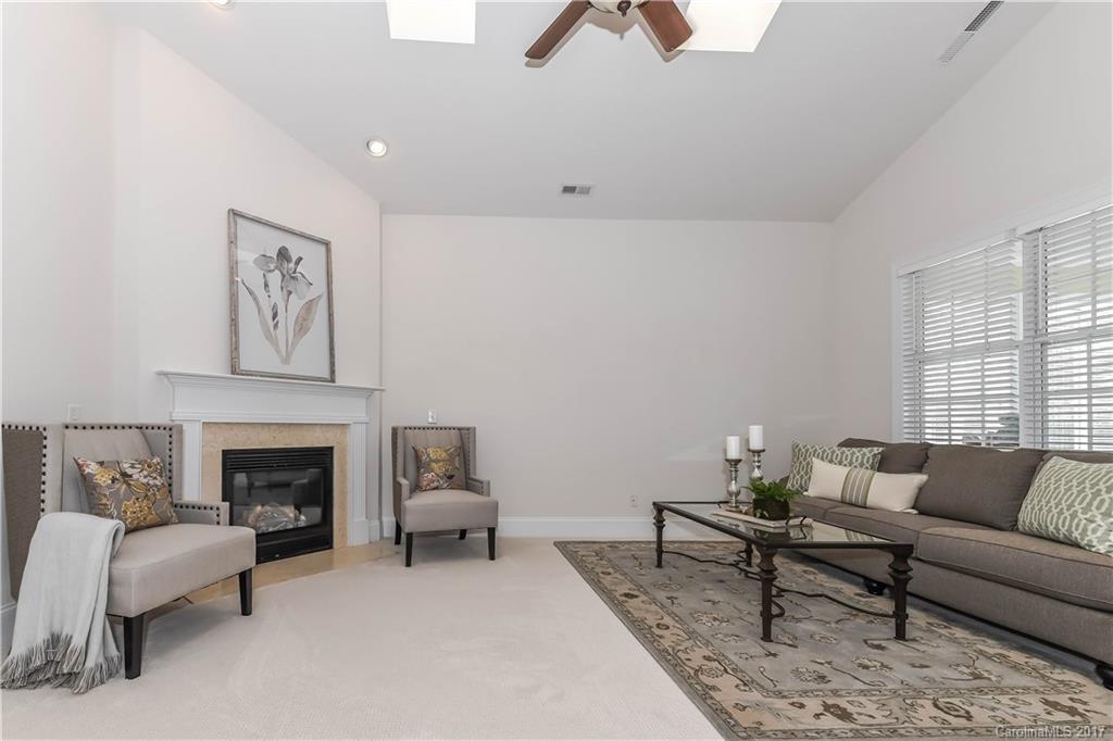 10944 Round Rock Road Charlotte, NC 28277 - Photo 11 of 23 a living room with furniture and a fireplace