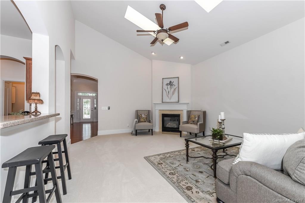 10944 Round Rock Road Charlotte, NC 28277 - Photo 12 of 23 a living room with furniture and a fireplace