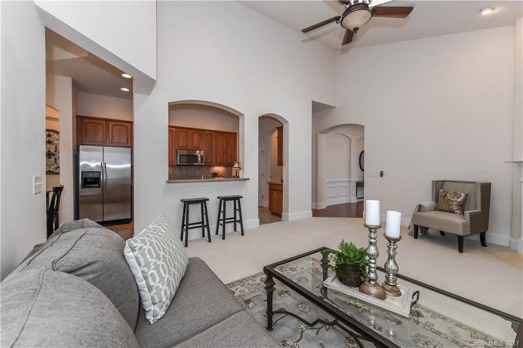 10944 Round Rock Road Charlotte, NC 28277 - Photo 13 of 23 a living room with furniture and a chandelier
