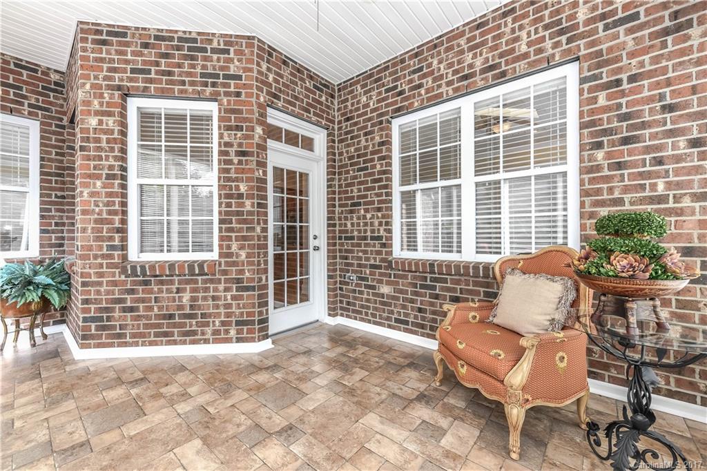 10944 Round Rock Road Charlotte, NC 28277 - Photo 21 of 23 a front view of a house with outdoor seating